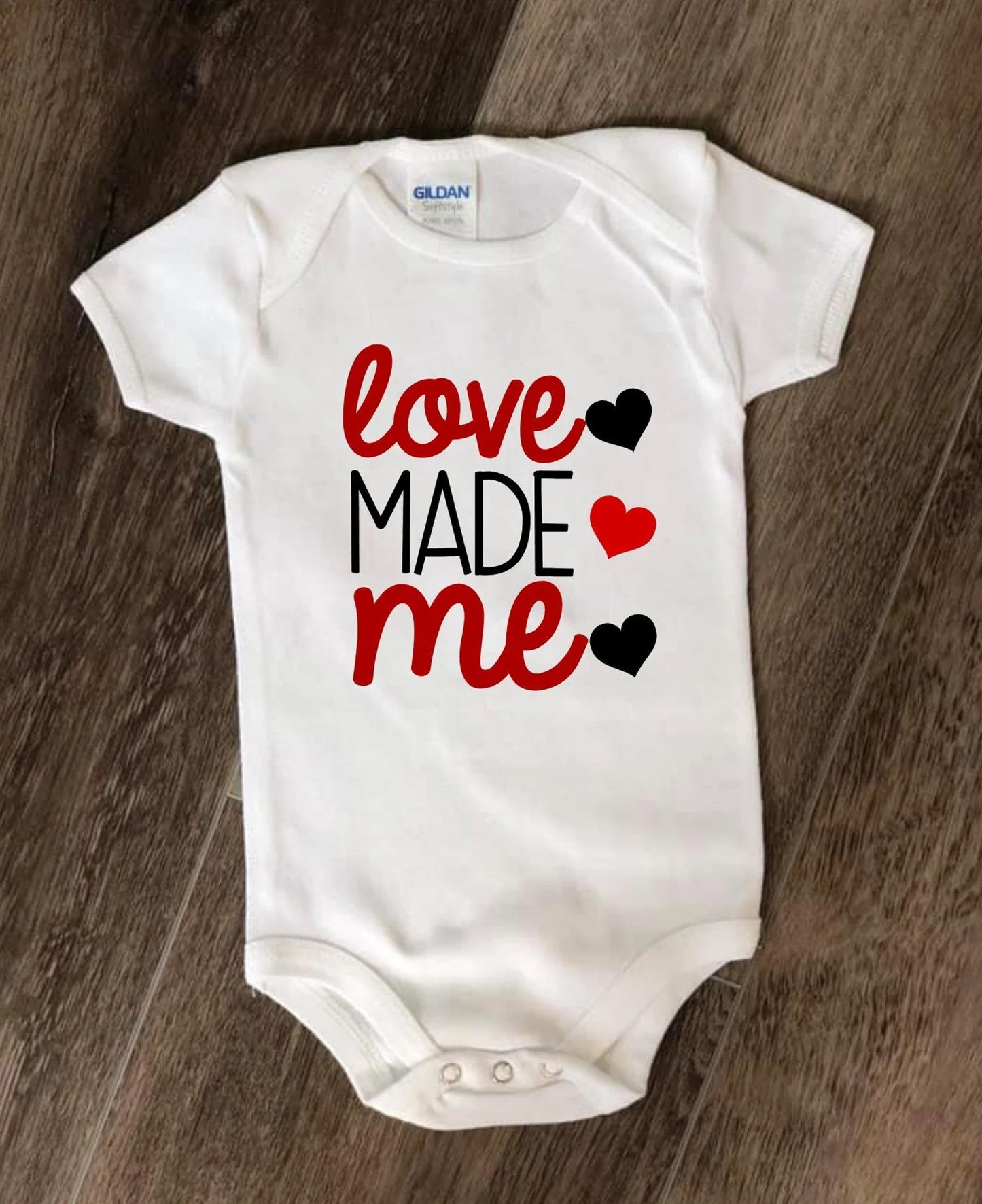 Love Made Me Baby Bodysuit